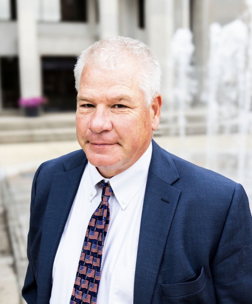 Former teacher calling for spending cuts, deregulation runs as Democrat